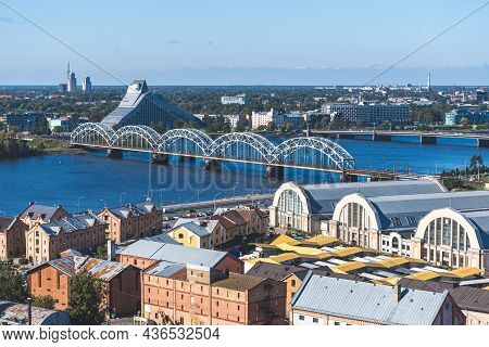 Riga, Latvia - September 19 2021:  Riga Panorama With Daugava River, Bridge, Central Market And Nati