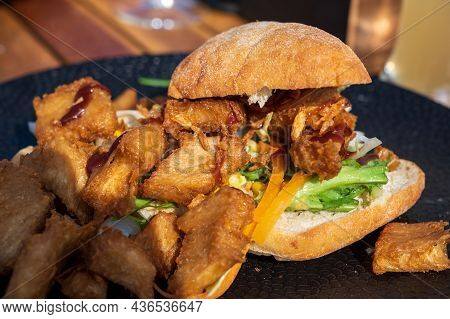 Italian Ciabata Bread Served With Fresh Salade And Vegan Fried Chicken In Pieces