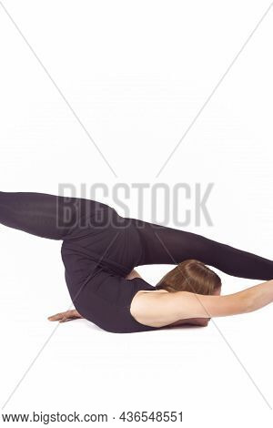 Sport Ideas And Concepts. Young Caucasian Sportswoman Rhythmic Gymnast In Training Black Outfit Duri