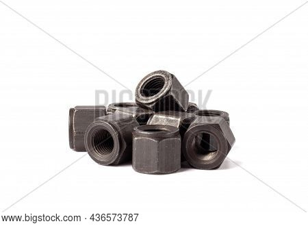 Bunch Of Metallic Nuts Isolated On White Background. Heavy Hex Nut. Female Screw Nut With Copy Space