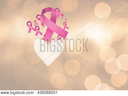 Digitally generated image of multiple pink ribbon and heart icon spots of light on yellow background. breast cancer awareness concept