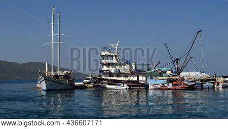 Boats and yachts at the in the marina of village Akyaka - slow city in Turkey.August 1,2021. Mugla,Turkey