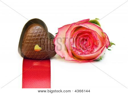Heart Shaped Chocolate And Rose Isolated Over White