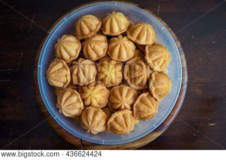 Kuih Bahulu, Baulu Or Bolu In A Container. Sponge Cake Baked In Special Aluminium Moulds Is The Asia