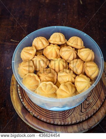 Kuih Bahulu, Baulu Or Bolu In A Container. Sponge Cake Baked In Special Aluminium Moulds Is The Asia