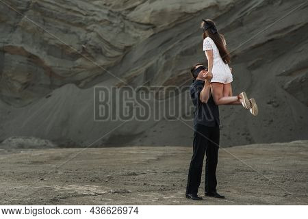 Romantic Couple Blindfolded With Black Ribbon Dancing. Love Blind Concept