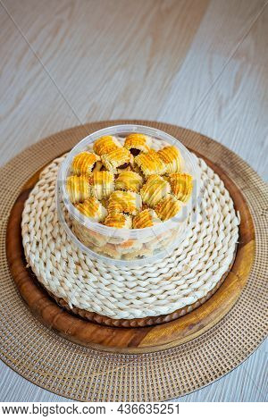 Traditional Pineapple Jam Tart Roll Cookies Or A Malay Called Tart Nanas In A Plastic Container.