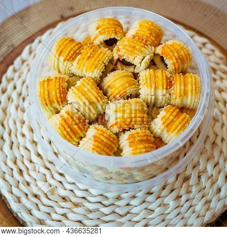 Traditional Pineapple Jam Tart Roll Cookies Or A Malay Called Tart Nanas In A Plastic Container.