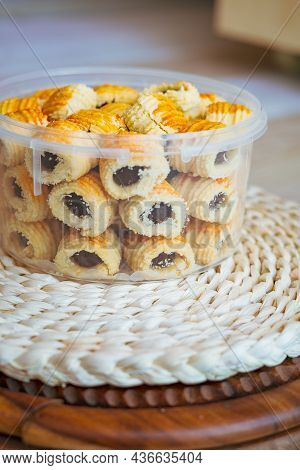 Traditional Pineapple Jam Tart Roll Cookies Or A Malay Called Tart Nanas In A Plastic Container.