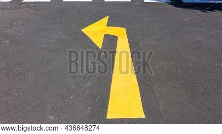 Road Fresh Yellow Arrow Sign For Route Direction On Asphalt Tarmac At Crossway Inter Section For Veh