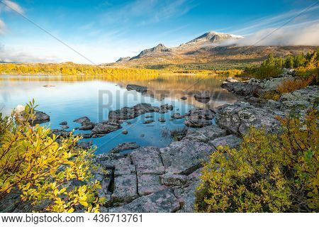 Mountain And Sky Reflecting In Lake In Early Morning Of Autumn. Autumn Colors In Remote Arctic Lands