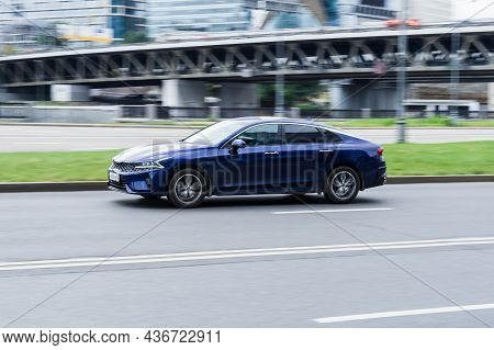 Moscow, Russia - October 2021: Kia K5 Dl3 On The City Road. Fast Moving Blue Shiny Korean Car On The