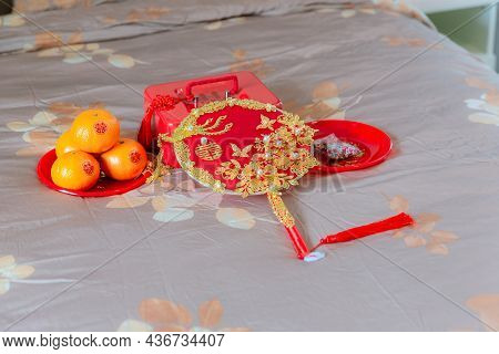 Accessories In A Chinese Wedding. A Fan For The Bride At A Wedding Is Object That Represents Good Me