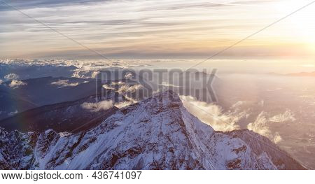 Aerial View Of Canadian Rocky Mountains With Snow On Top During Fall Season Sunset. Nature Landscape