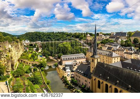 Panoramic View On Abbaye De Neumunster And St. Jean Du Grund Church In Luxembourg A Beautiful Summer
