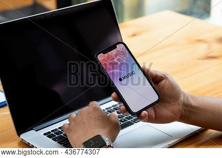 Chiang Mai, Thailand - Aug 22, 2021: A Man Hand Holding Screen Shot Of Apple Music App Showing On Ip