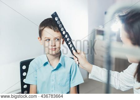 Ophthalmologist Checks The Boy's Vision. Hyperopia. Vision Tests In Children.