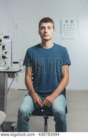 Young Man At A Reception Ophthalmologist. Copy Space