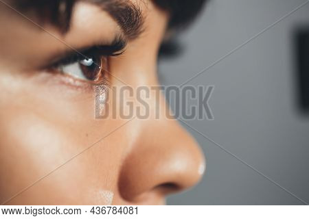 Girl Doctor Looking Through A Microscope, Conducting An Experiment. Close-up Eyes. Research In Pharm