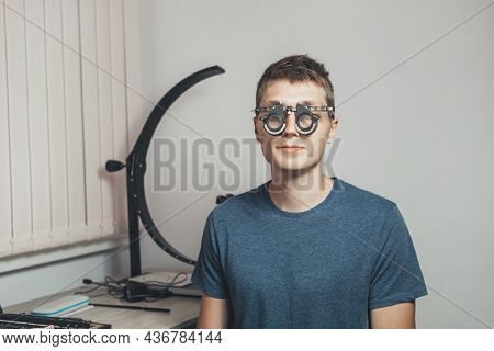 Male Patient To Wear Glasses For Vision Correction. Hospital, Medical Examination. Vision Tests At H