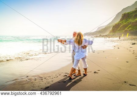 Lifestyle Of Caucasian Senior Couple Dance On Beach, Happy In Love Romantic And Relax Time, Tourism 