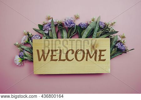 Welcome Sign With Flowers Frame Decprate On Pink Background