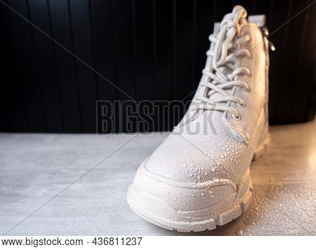 Water Droplets On Winter Shoe Protected With Waterproof Spray