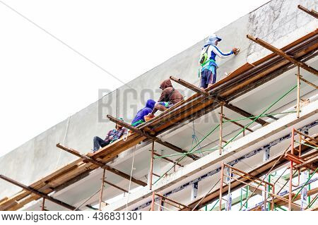 Several Male Workers On The Construction Of A High-rise Building Around The Simpang Lima Boyolali Ci