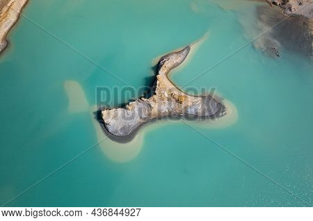 Drone View Of The Turquoise Lake Formed As A Result Of Mining Waste