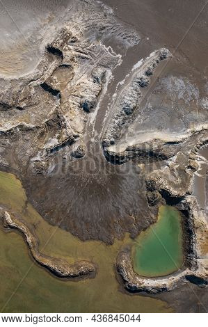 Drone View Of The Turquoise Lake Formed As A Result Of Mining Waste