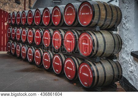 Bushmills, Northern Ireland, Aug 2019 Rows Of Large Wooden Barrels With Maturing Single Melt Bushmil
