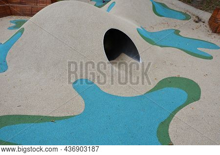 Dreamy White Rubber Landscape With Scoops And Colorful Spots On The Playground. Stainless Steel Tunn