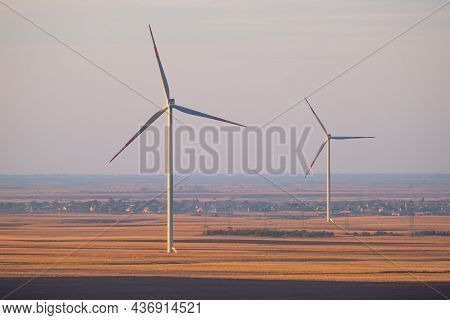Wind Turbines In Serbia, Europe. Late Afternoon Landscape Image Of Wind Turbine Park In Windy Lowlan