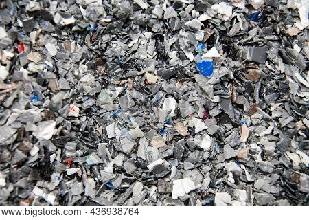 Background Of Plastic Polymer Flakes For Recycling.