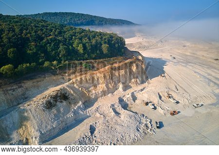 Aerial View Of Open Pit Mining Site Of Limestone Materials Extraction For Construction Industry With