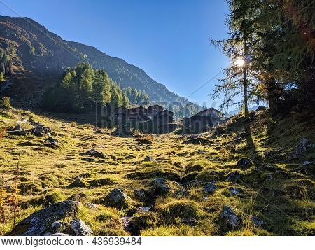 Idyllic Mountain Landscape In The Alps Above Monstein, Davos. Beautiful Wooden Houses, Chalets With 