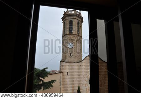 View From The Window To The Bell Tower With The Clock. The Old Bell Tower Against The Sky.