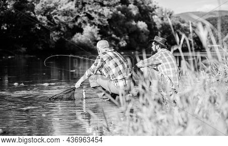Two Male Friends Fishing Together. Big Game Fishing. Relax On Nature. Happy Fishermen Friendship. Re