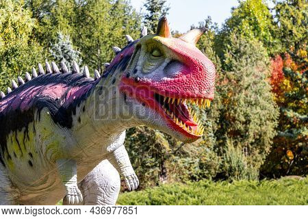 Ukraine, Khmelnitsky, October 2021. Dinosaur, Carnotaurus Close Up With Open Mouth And Sharp Teeth