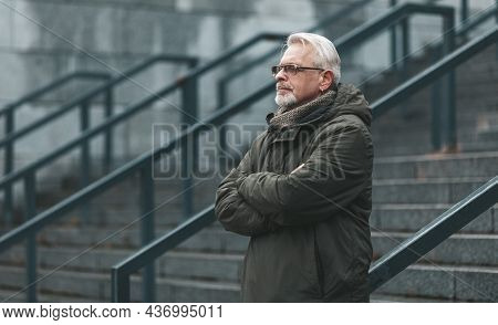 Depression On A Cloudy Autumn Day. An Elderly Man Alone With Problems, Lonely Old Age.
