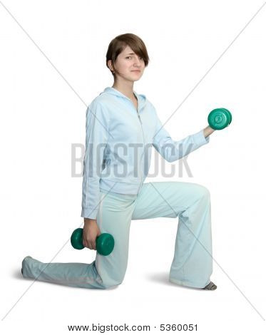 Pige i blå Gym tøj med vægtstang