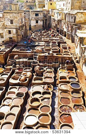 Tanners working leather in the old tannery of Fes, Morocco