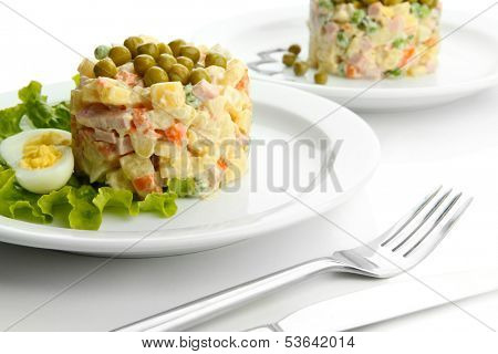 Russian traditional salad Olivier, isolated on white
