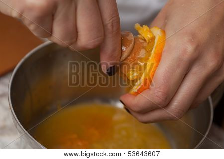 Gourmet chef using a citrus reamer
