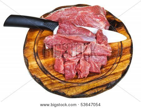 Top View Of Cut Raw Meat On Wooden Board