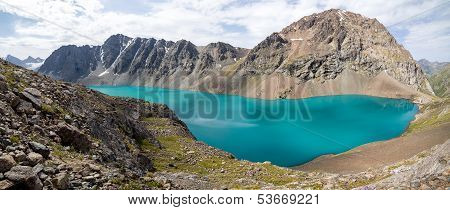 Panoramic view of Ala-Kul lake in Kyrgyzstan