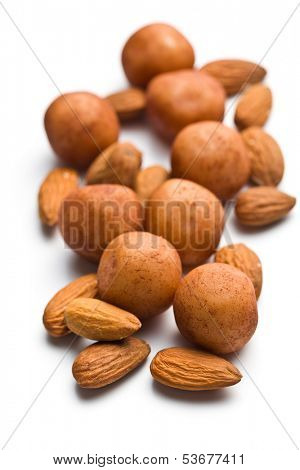 marzipan balls and almonds on white background