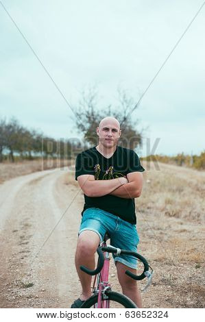 Hipster Young Man On Bike