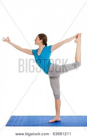 Yoga - young beautiful slender woman yoga instructor doing Lord of the Dance Pose (Natarajasana) asana exercise isolated on white background