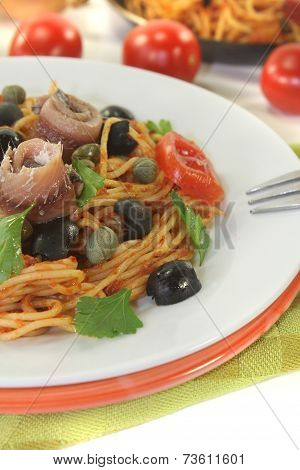Spaghetti Alla Puttanesca With Olives, Capers And Anchovies